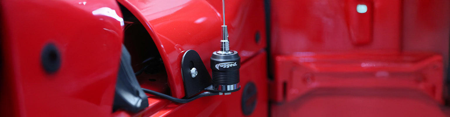 Antennas and accessories—handheld and mobile antennas (NGP whip, low‑profile stealth, wide‑band), plus installation hardware like BNC connectors, spring bases, ground straps/discs, allen tools, and replacement parts.