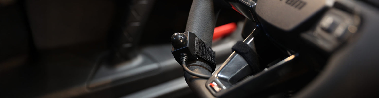 Intercom and handheld radio PTT buttons—Velcro‑mount PTTs (coil and straight), hole‑mount steering‑wheel PTTs, quick‑disconnect PTTs, rocker switch buttons, foot‑pedal PTT, belts‑station PTT, extension cables, and intercom‑to‑car harness adapters.