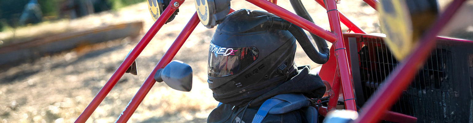Pre-wired Snell and DOT-certified off-road helmets—including open and full-face styles—prepped for air pump systems