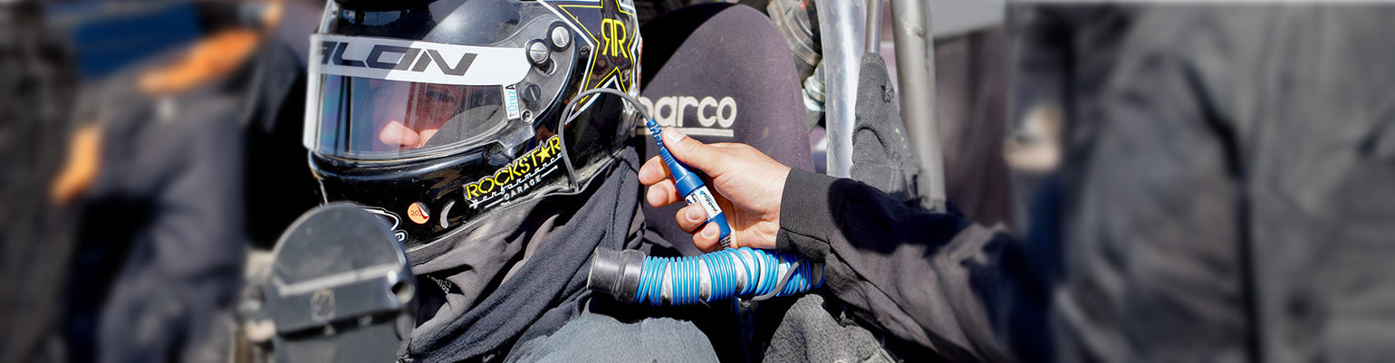 Race-ready communications harness connecting handheld radio, helmet kit, and push-to-talk