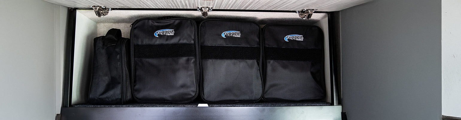 Rugged Radios Collection nylon headset storage bag with soft‑liner interior, sturdy carry handle, foam‑padded dividers for single, dual, or quad headset organization